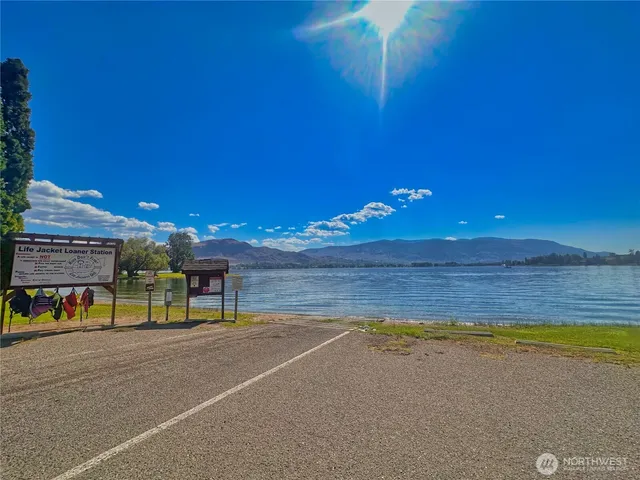 a view of a swimming pool with an outdoor space and seating area