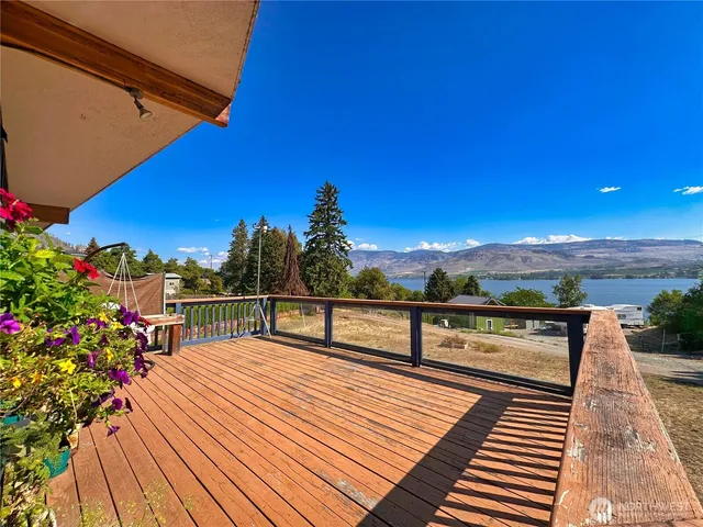 a view of a balcony with wooden floor