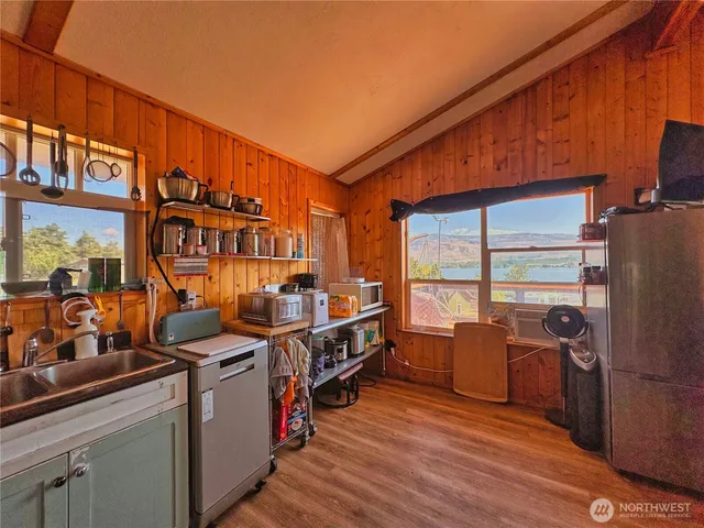 a view of a kitchen with appliances and cabinets