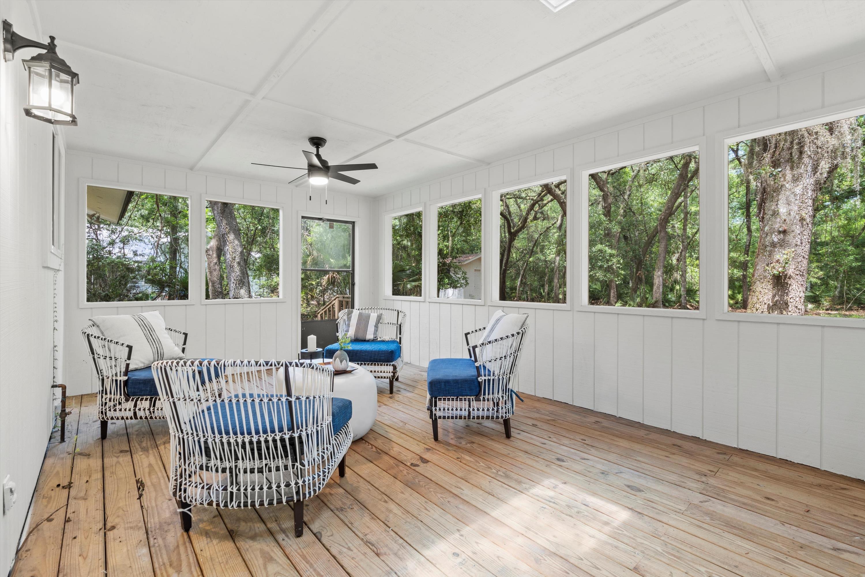 2884 Kings Road St. Augustine, FL 32086 - Photo 17 of 27 a living room with furniture and a floor to ceiling window