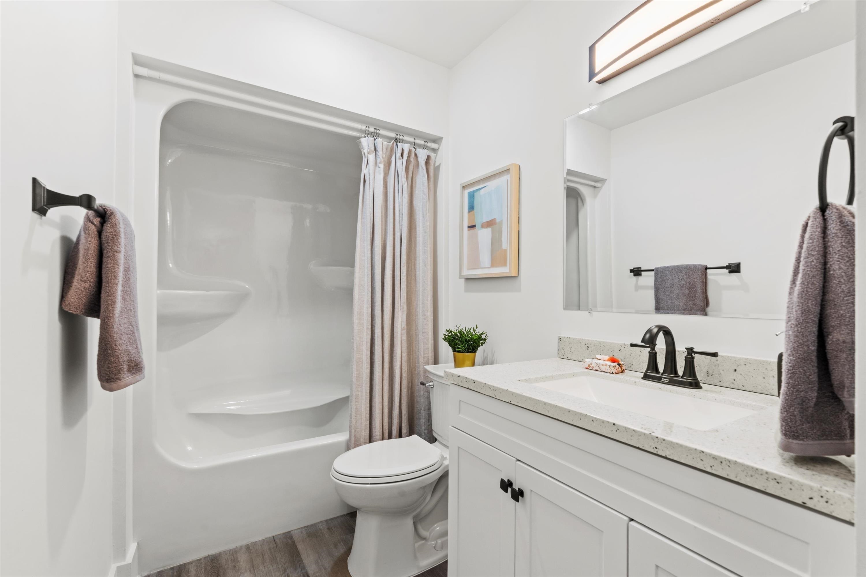 2884 Kings Road St. Augustine, FL 32086 - Photo 23 of 27 a bathroom with a sink a toilet and shower