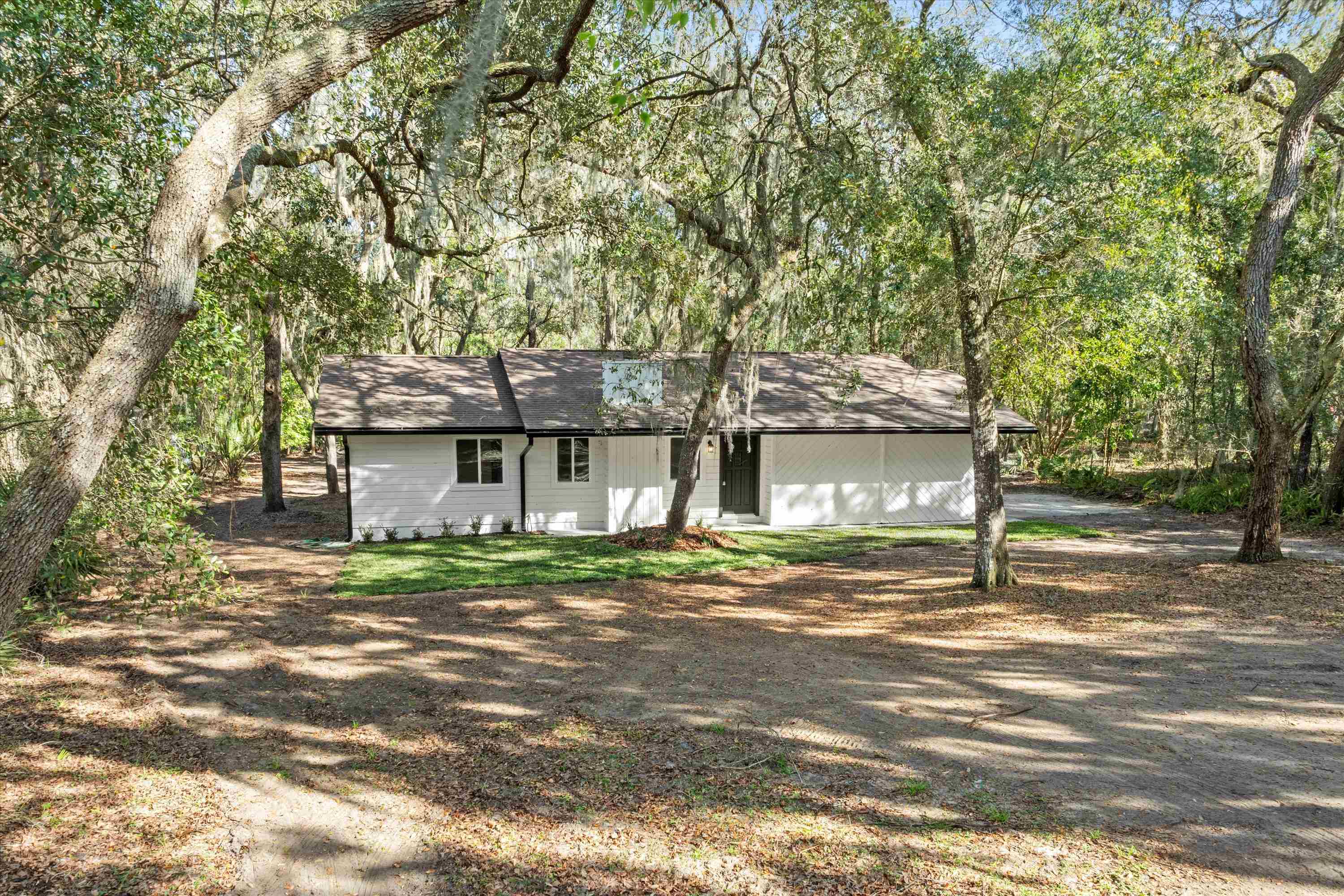 2884 Kings Road St. Augustine, FL 32086 - Photo 24 of 27 a view of a house with a yard and large tree