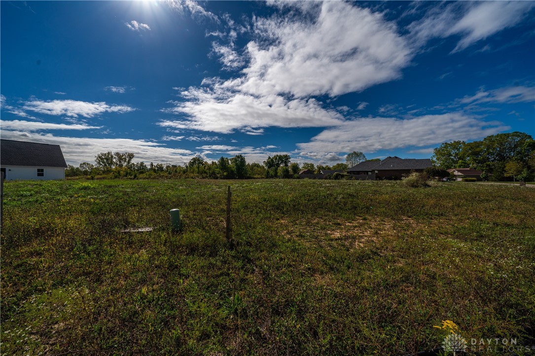 1503 Kingsgate Road Springfield, OH 45503 - Photo 3 of 10 Expansive green lot provides a blank canvas for building your dream home, offering open space and natural surroundings.