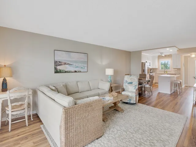 a living room with furniture and a table