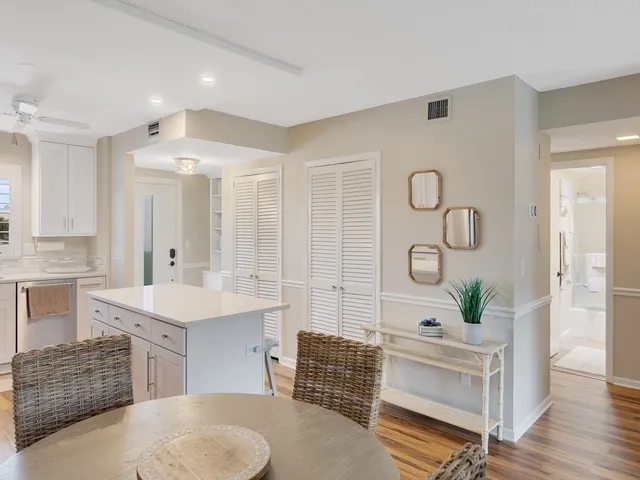 a spacious bathroom with a double vanity sink a mirror a bathtub and