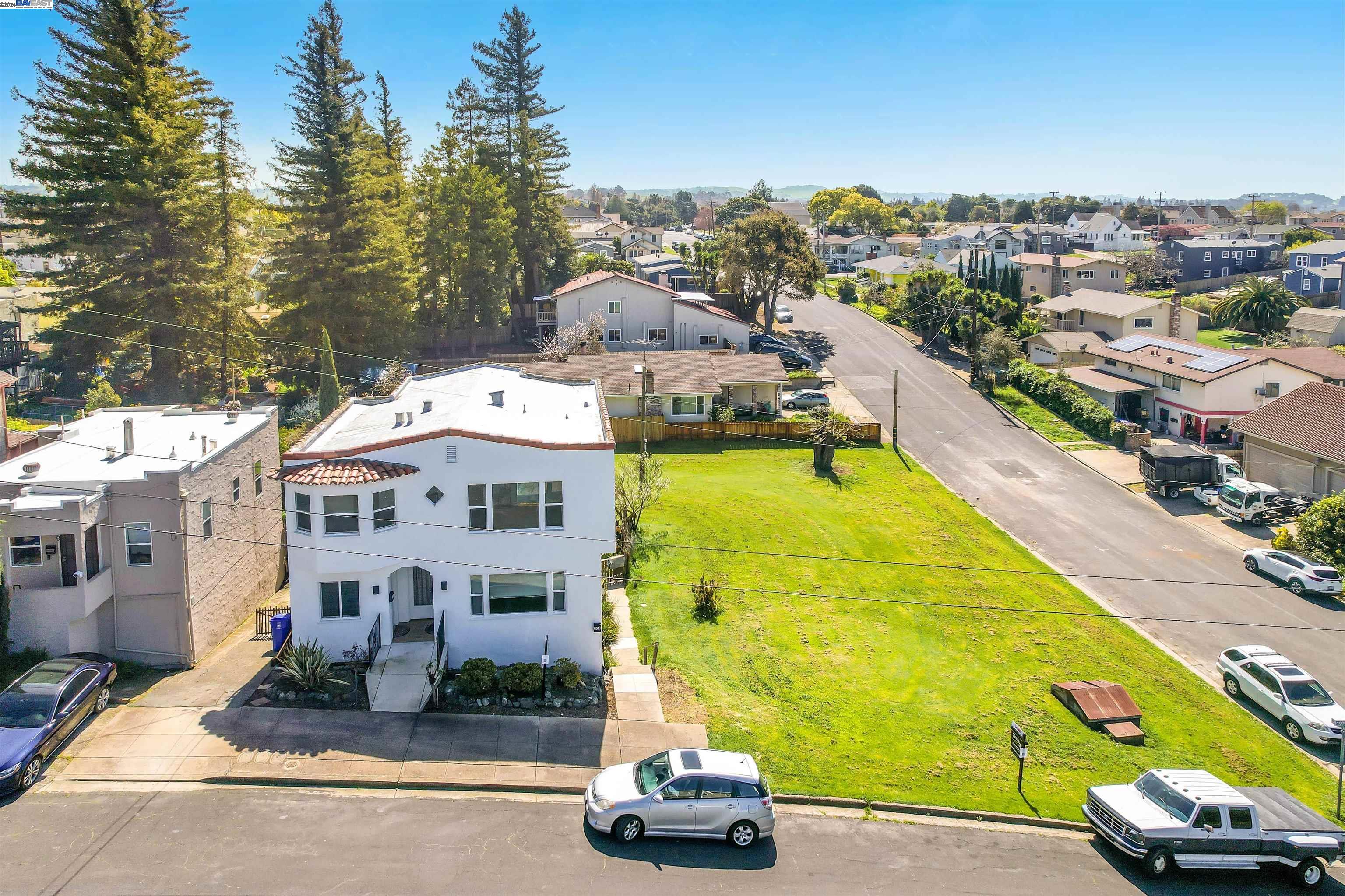 an aerial view of a house with a swimming pool