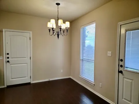 a view of a windows and chandelier in a room
