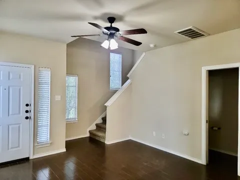 a view of an entryway with wooden floor