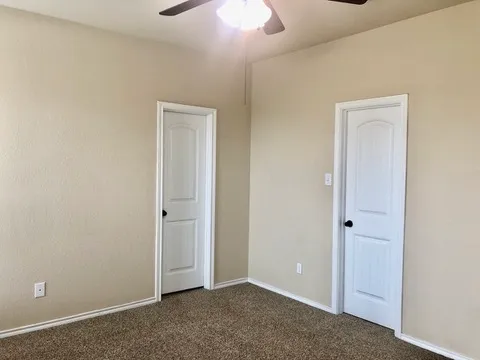 an empty room with closet area