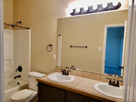 a bathroom with a sink and mirror