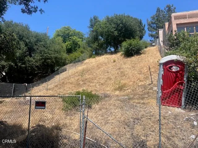 a view of a backyard of the house