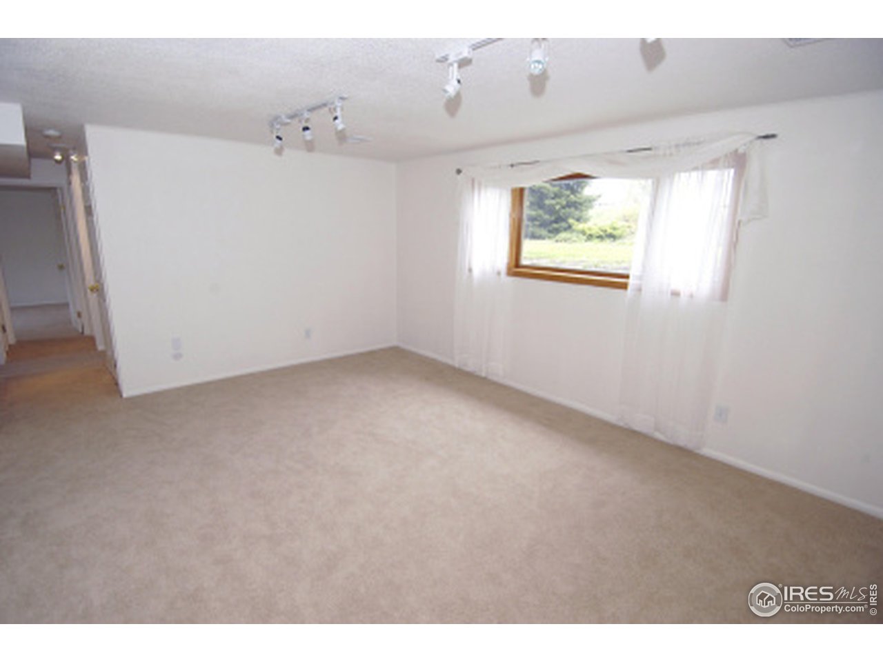 7631 Baseline Road Boulder, CO 80303 - Photo 8 of 12 a view of an empty room with a window