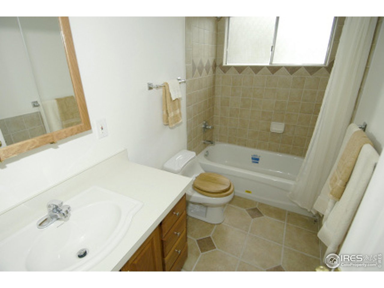 7631 Baseline Road Boulder, CO 80303 - Photo 10 of 12 a bathroom with a sink a toilet and shower