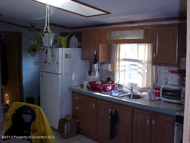 Lot #65 Pride Manor Conklin, NY 13748 - Photo 2 of 6 a kitchen with refrigerator and window