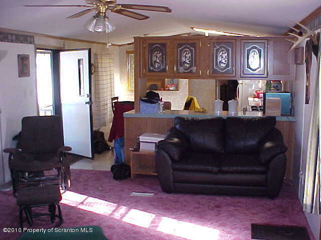 Lot #65 Pride Manor Conklin, NY 13748 - Photo 3 of 6 a living room with furniture and a flat screen tv