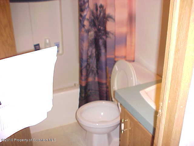 Lot #65 Pride Manor Conklin, NY 13748 - Photo 4 of 6 a bathroom with a sink and toilet