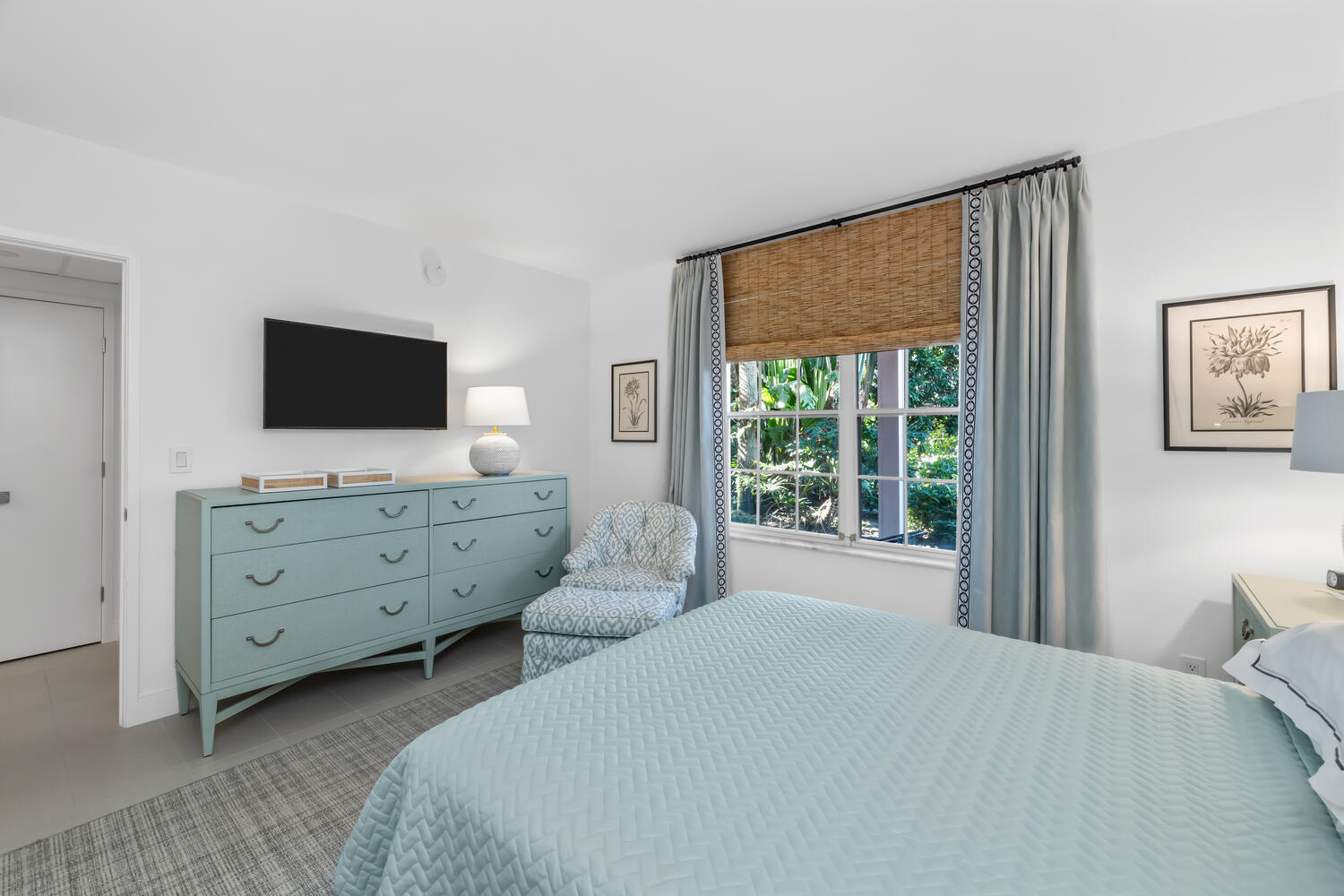 134 Peruvian Avenue, Unit 104 Palm Beach, FL 33480 - Photo 12 of 20 a bedroom with a bed and a flat screen tv