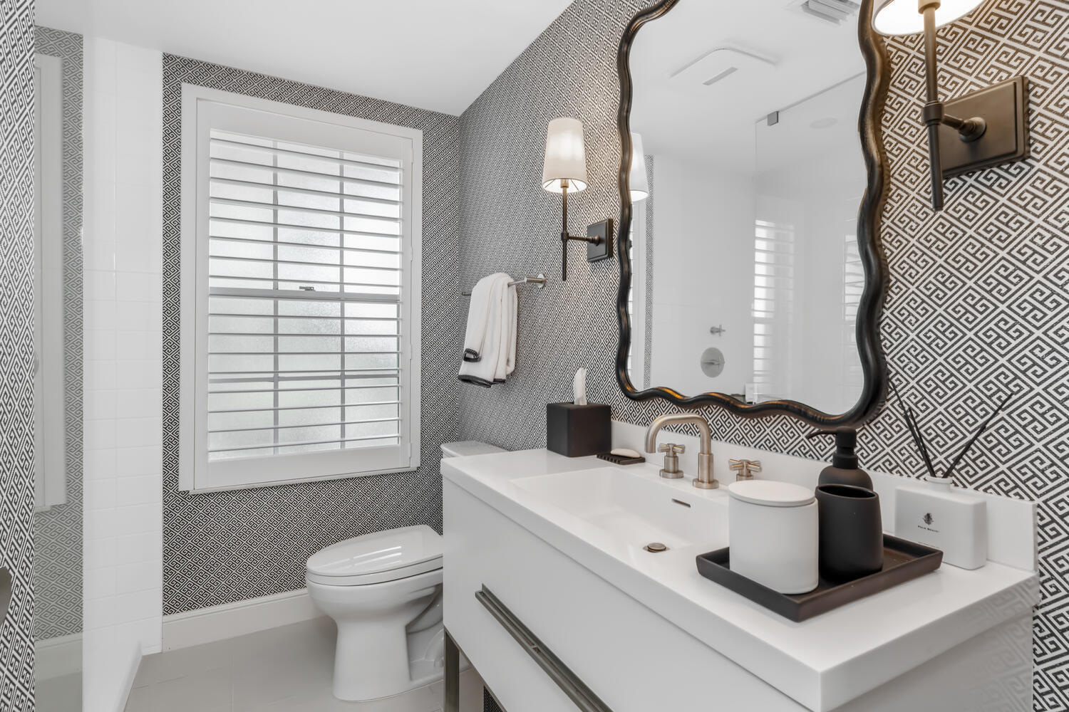 134 Peruvian Avenue, Unit 104 Palm Beach, FL 33480 - Photo 13 of 20 a bathroom with a sink toilet and mirror