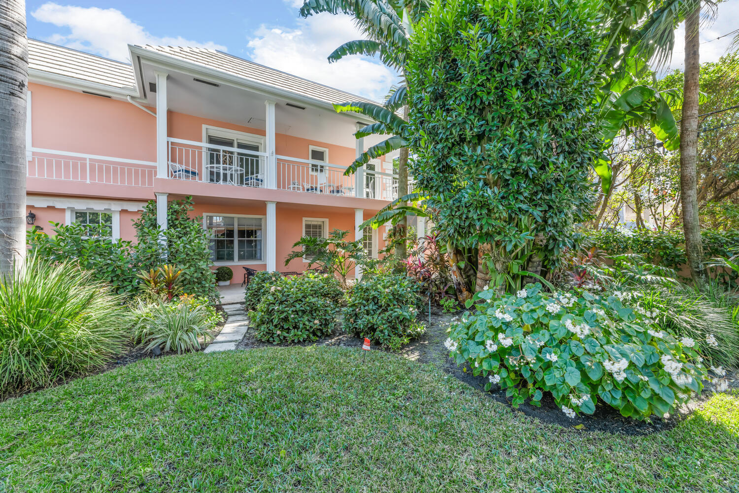 134 Peruvian Avenue, Unit 104 Palm Beach, FL 33480 - Photo 17 of 20 a view of a building next to a yard