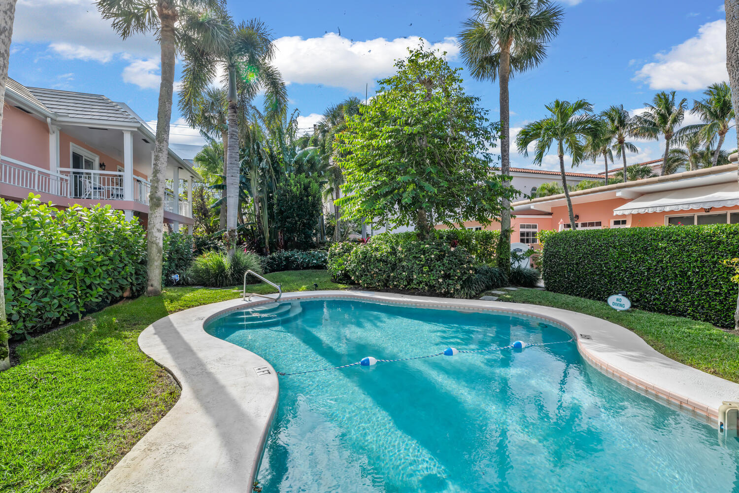 134 Peruvian Avenue, Unit 104 Palm Beach, FL 33480 - Photo 18 of 20 a view of yard with swimming pool and outdoor seating