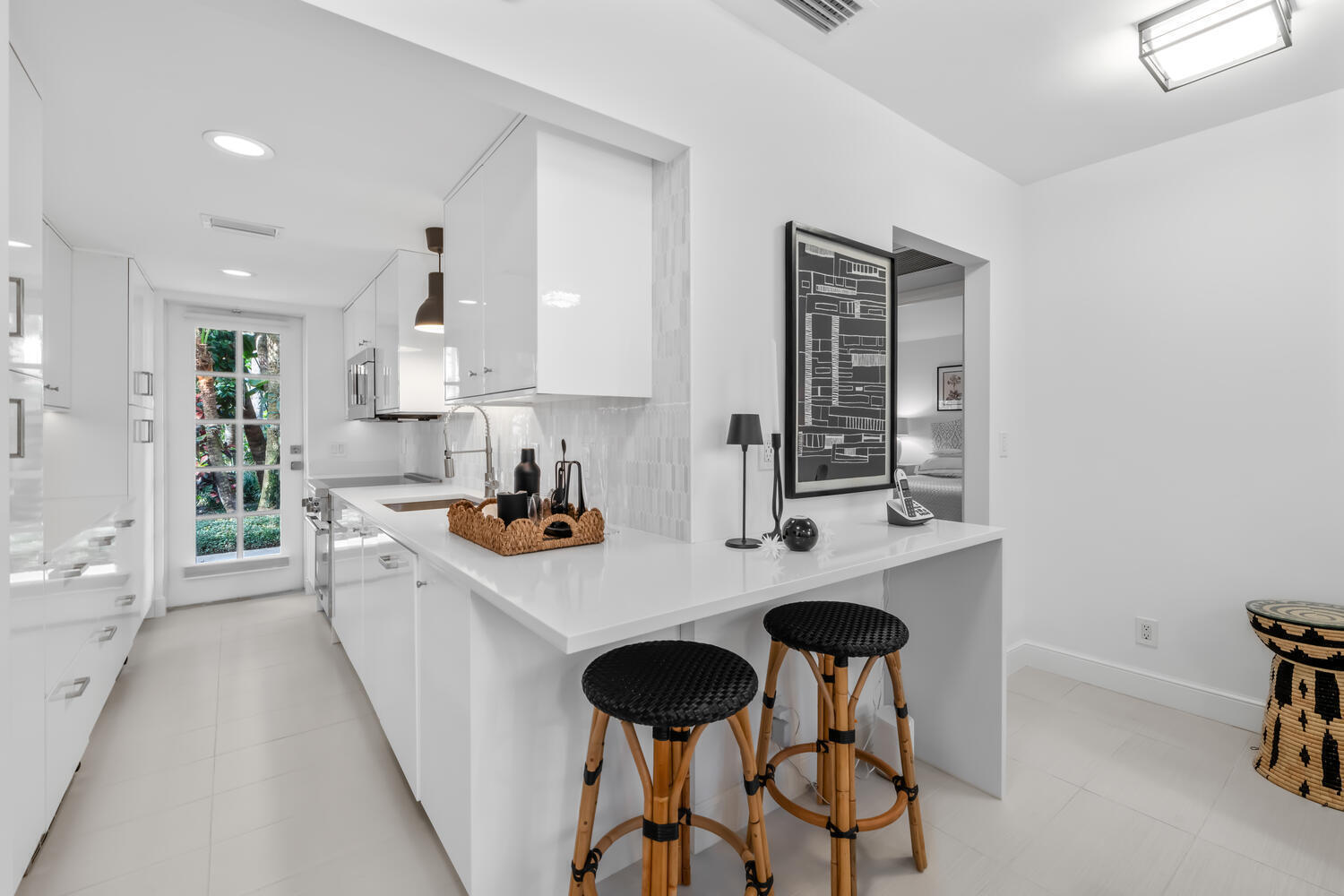 134 Peruvian Avenue, Unit 104 Palm Beach, FL 33480 - Photo 3 of 20 a kitchen with stainless steel appliances a sink stove and cabinets