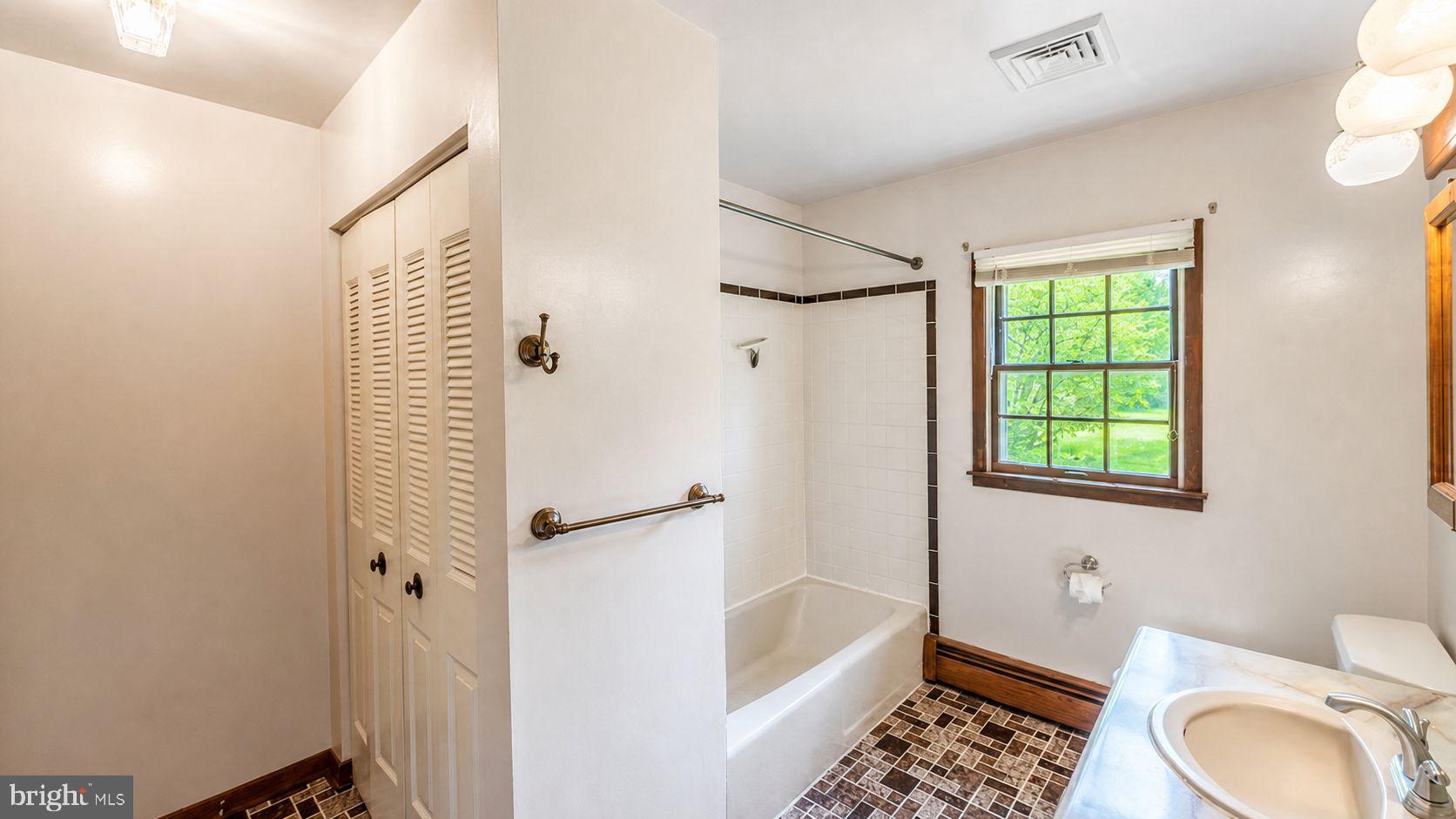 223 Trythall Road Elverson, PA 19520 - Photo 52 of 78 a bathroom with a sink toilet and shower