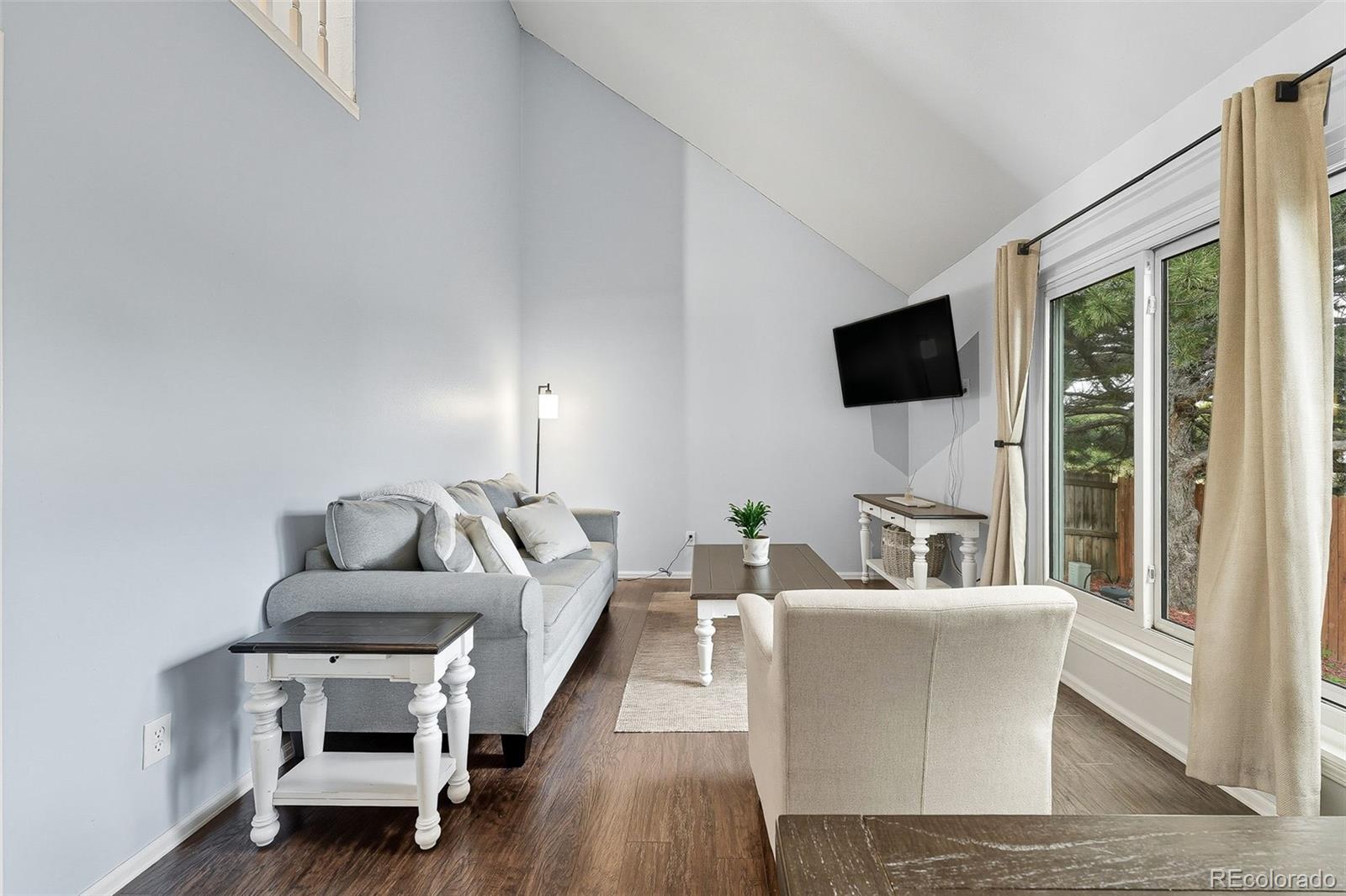 6080 Fenton Street Arvada, CO 80003 - Photo 11 of 48 a living room with furniture and a flat screen tv