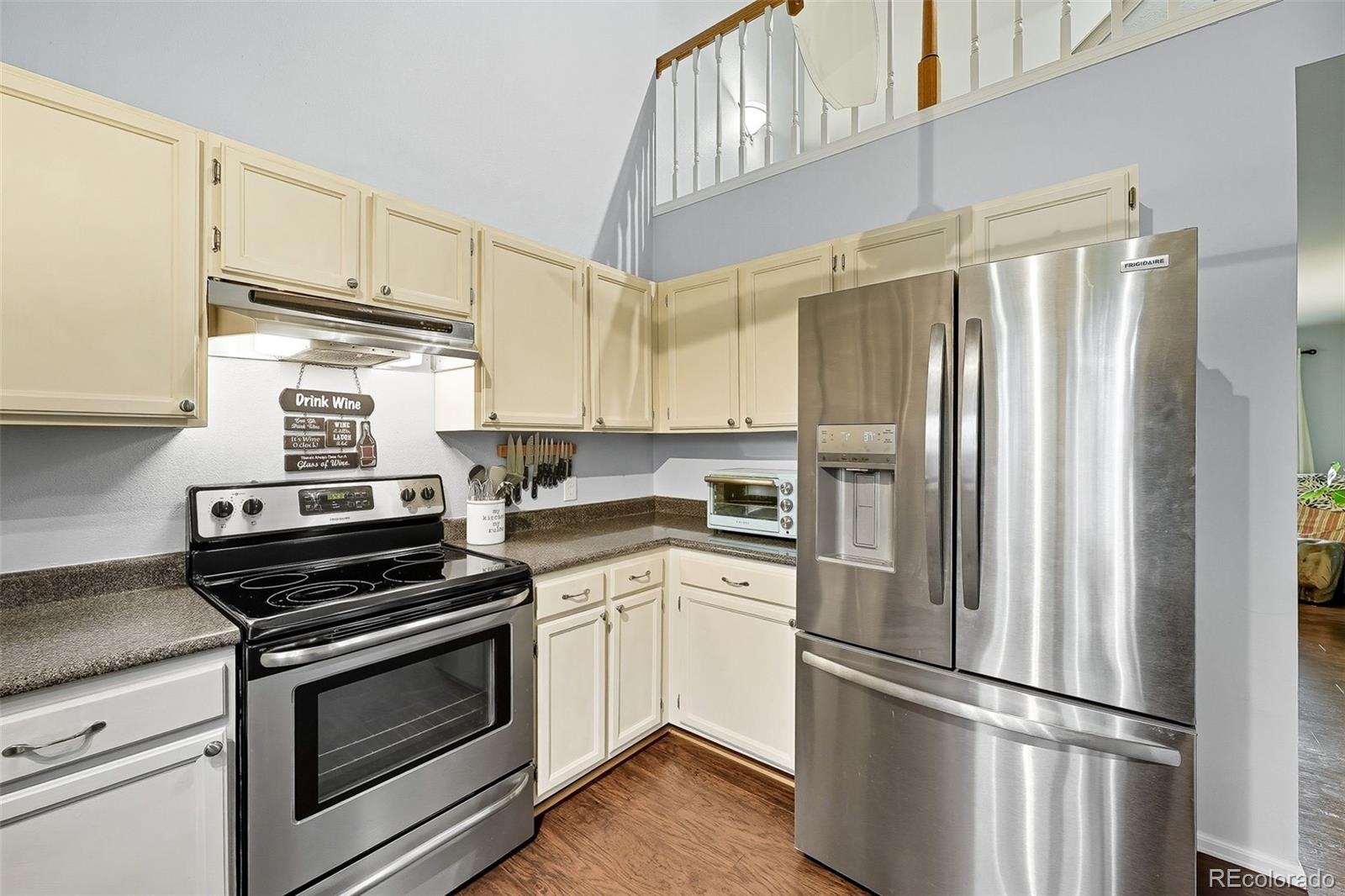 6080 Fenton Street Arvada, CO 80003 - Photo 19 of 48 a kitchen with cabinets and stainless steel appliances