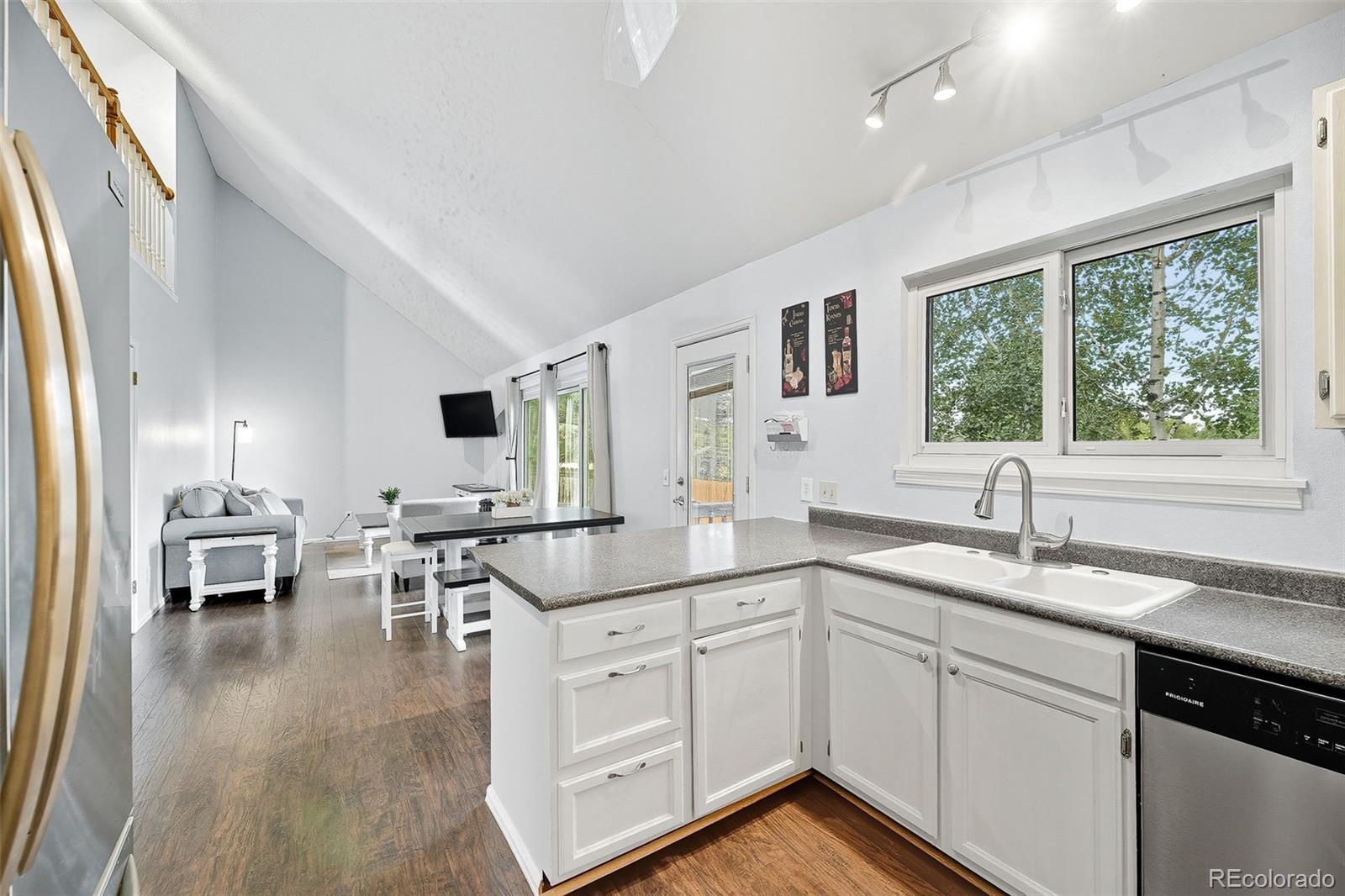 6080 Fenton Street Arvada, CO 80003 - Photo 20 of 48 a kitchen with a sink stove and cabinets