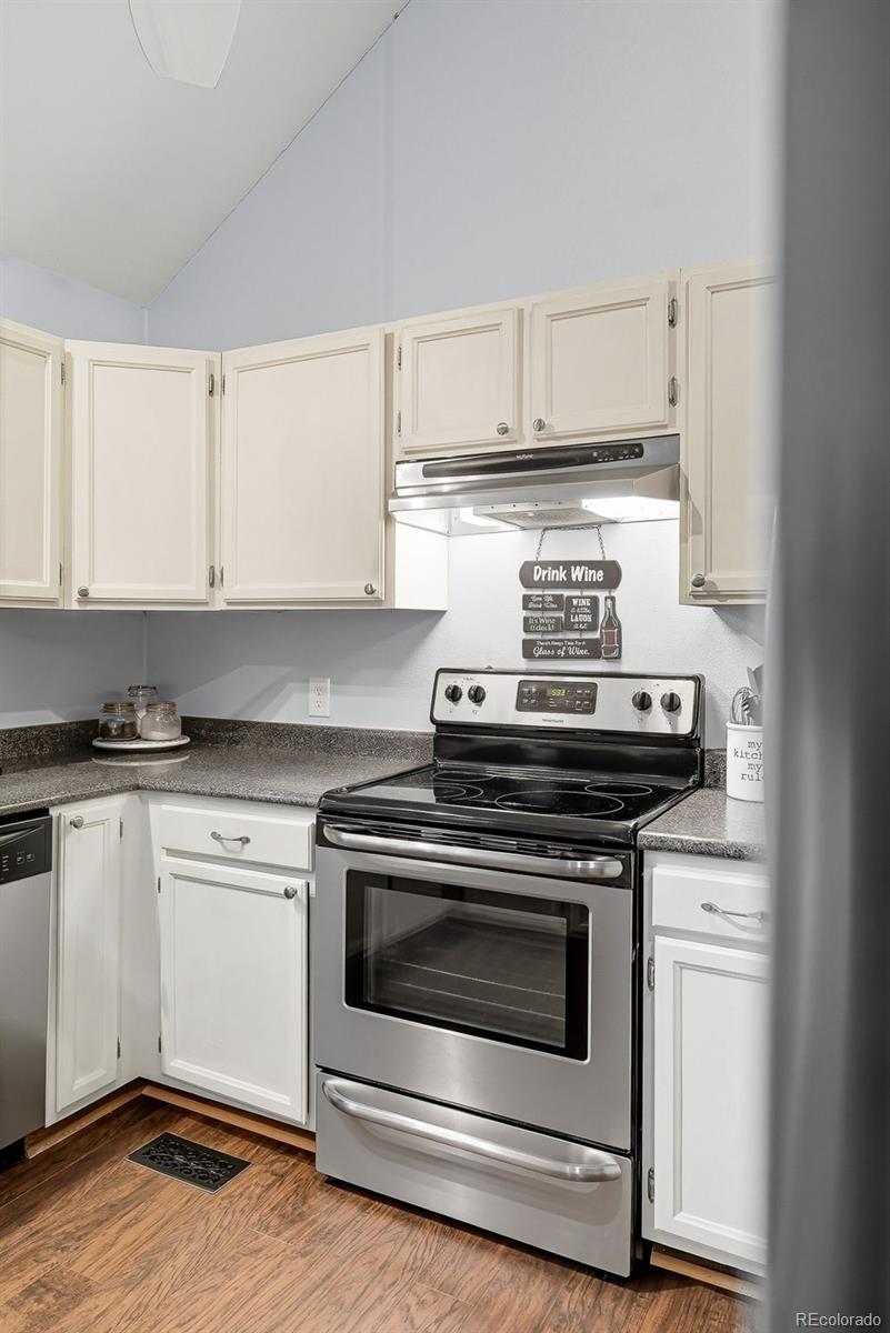 6080 Fenton Street Arvada, CO 80003 - Photo 21 of 48 a stove top oven sitting inside of a kitchen