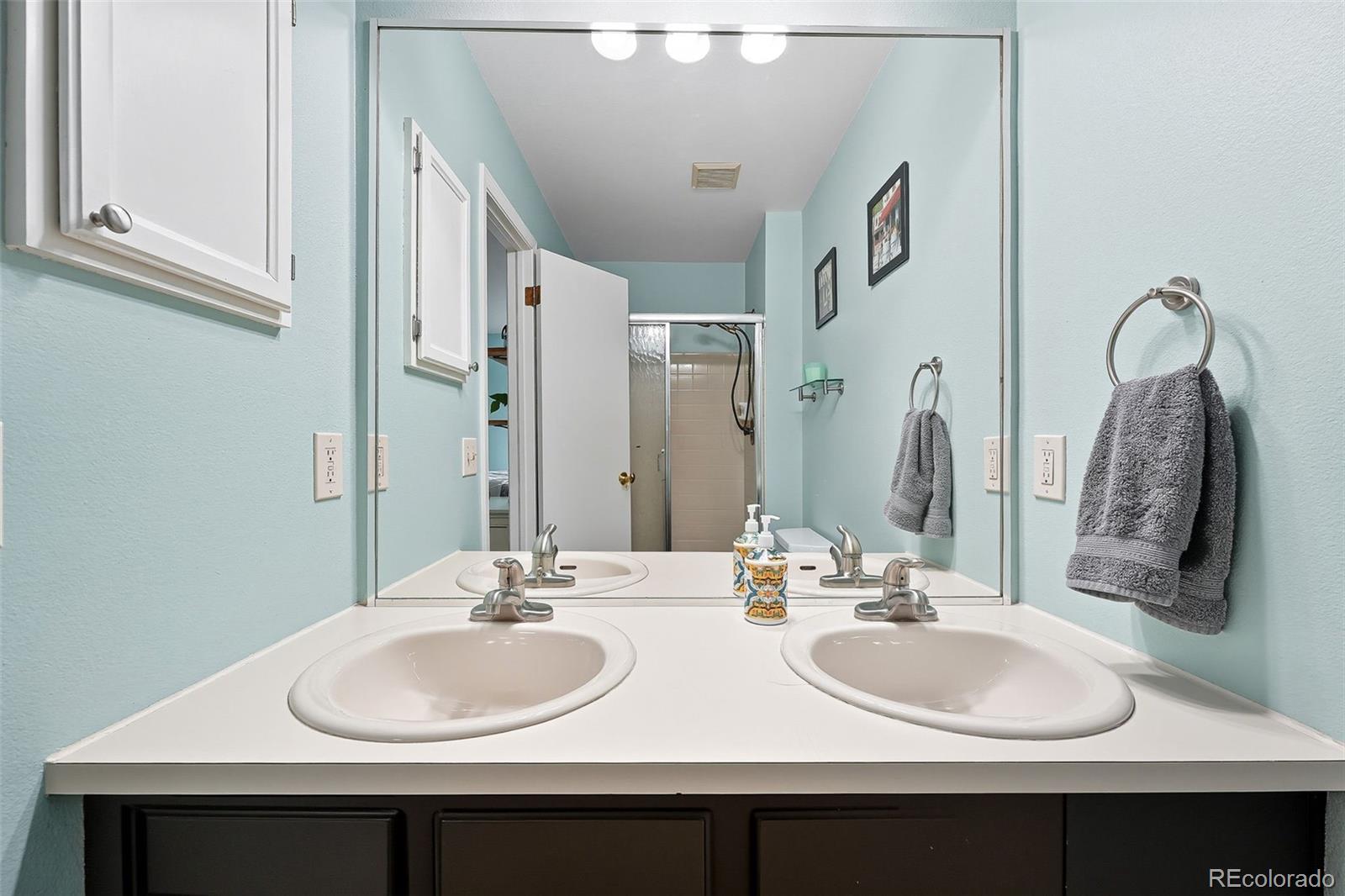 6080 Fenton Street Arvada, CO 80003 - Photo 23 of 48 a bathroom with double sink and a mirror