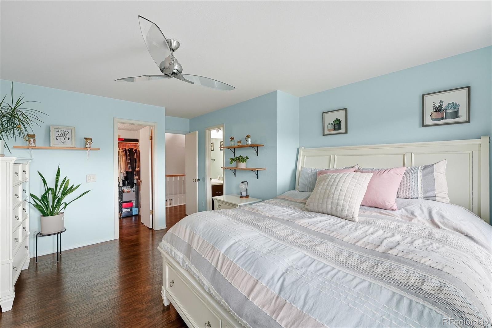 6080 Fenton Street Arvada, CO 80003 - Photo 29 of 48 a bed room with a bed and a book shelf
