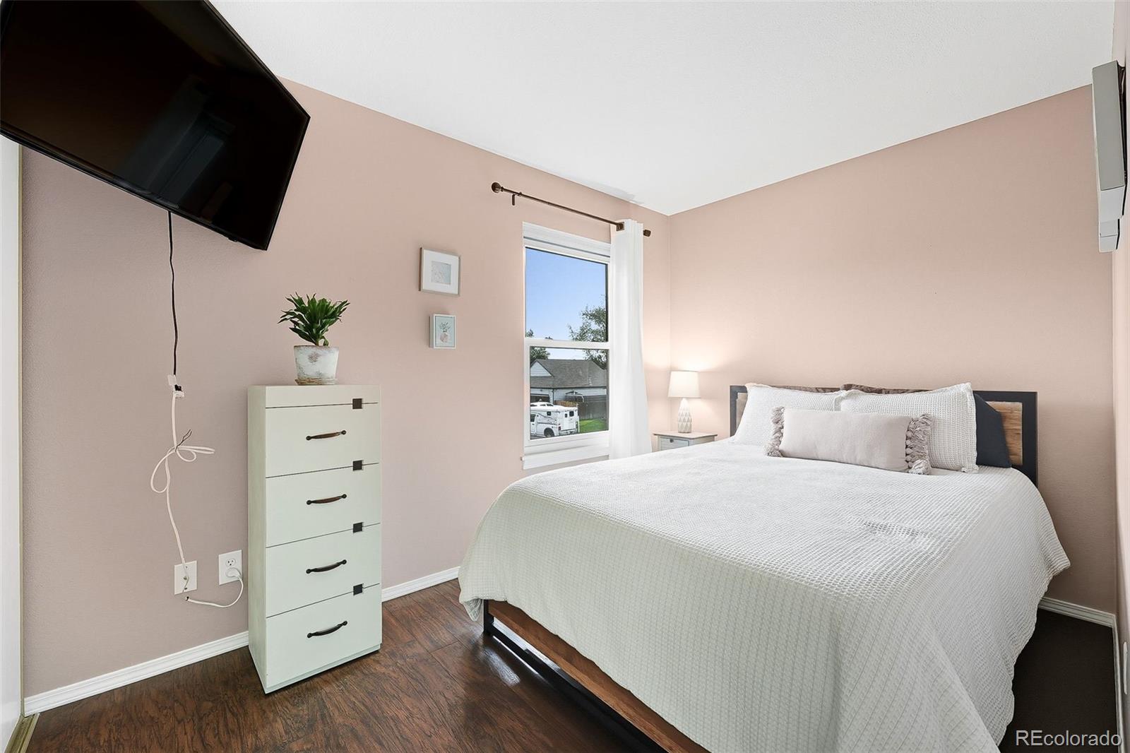 6080 Fenton Street Arvada, CO 80003 - Photo 33 of 48 a bedroom with a bed and a dresser