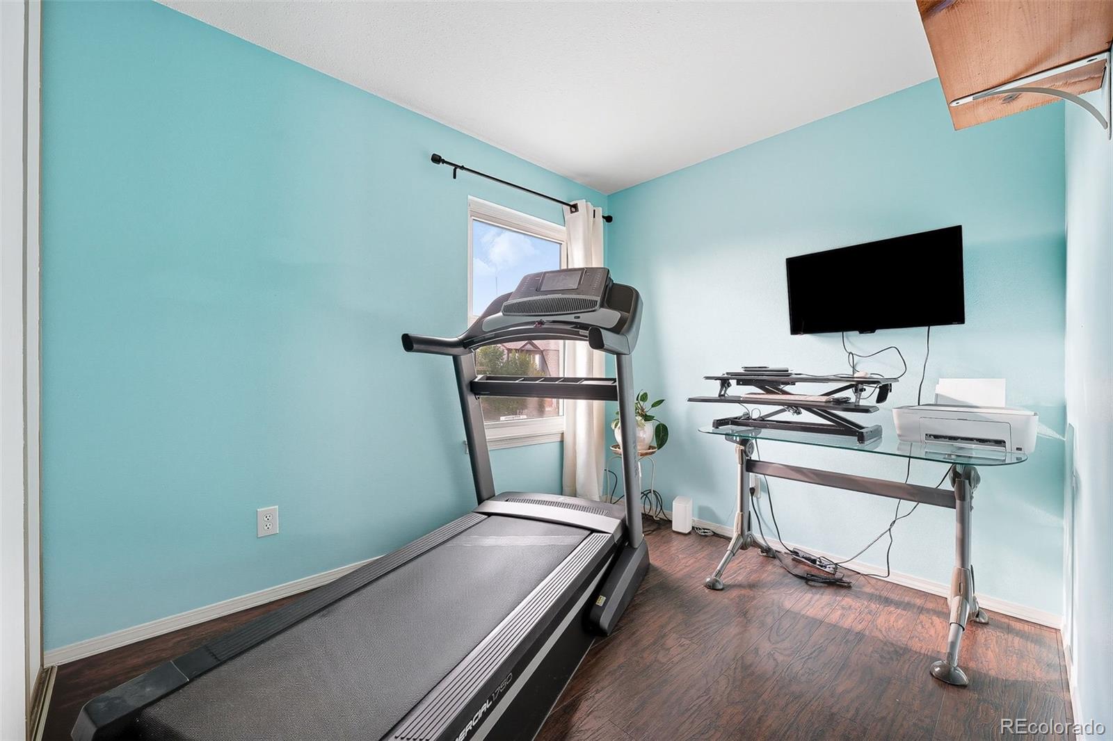 6080 Fenton Street Arvada, CO 80003 - Photo 35 of 48 a room with a chair and gym equipment