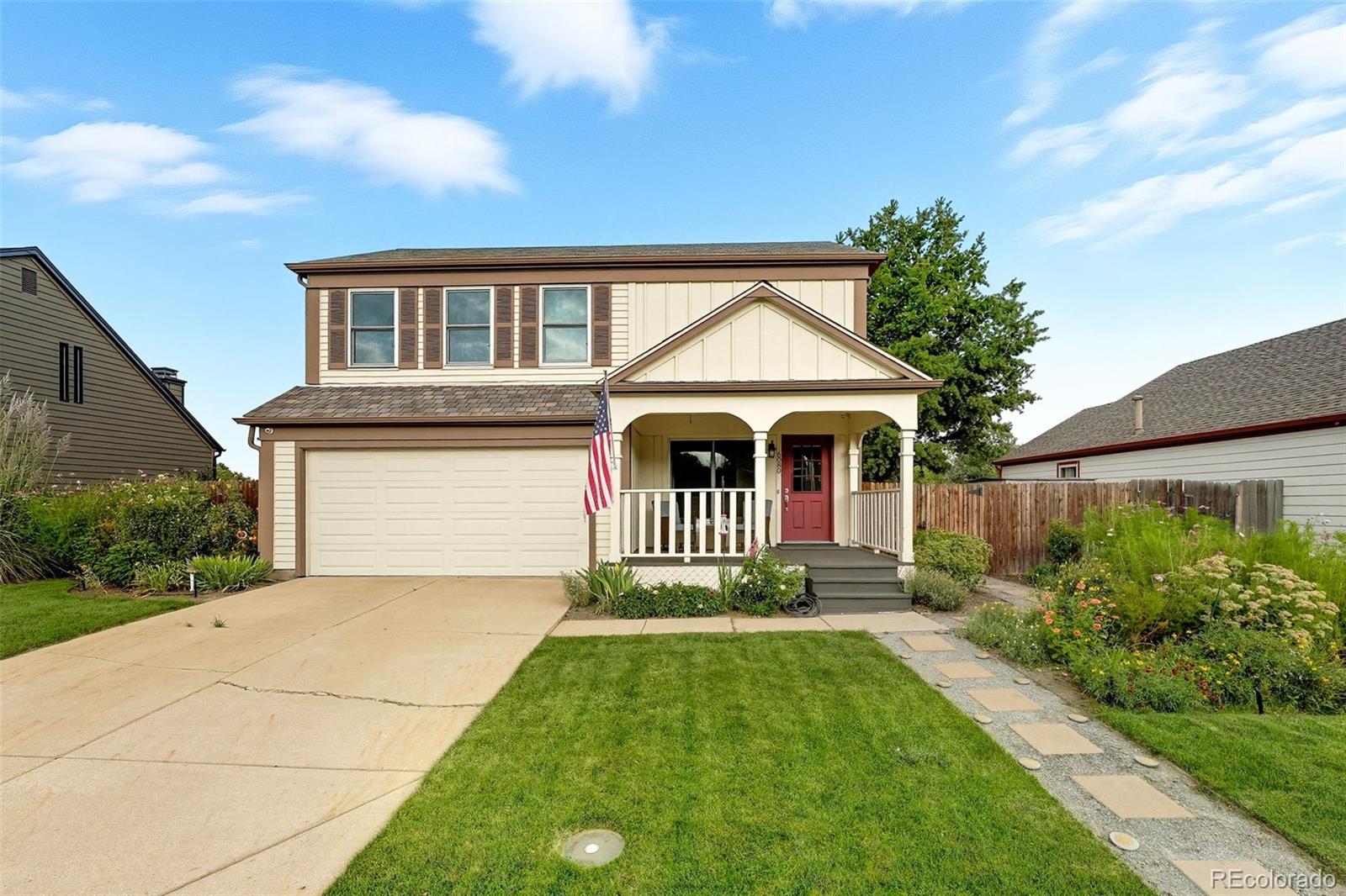 6080 Fenton Street Arvada, CO 80003 - Photo 36 of 48 a front view of a house with garden