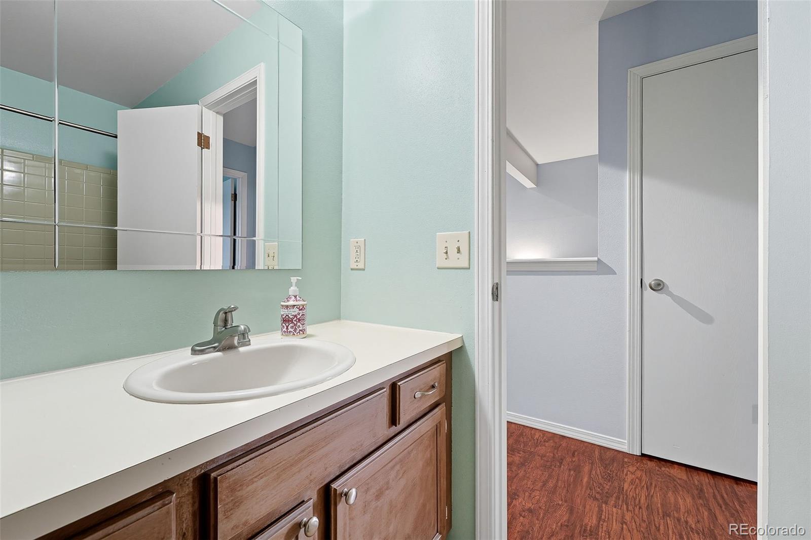 6080 Fenton Street Arvada, CO 80003 - Photo 38 of 48 a bathroom with a sink and a mirror