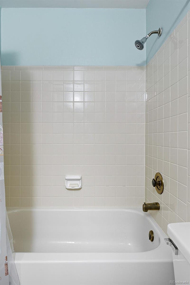 6080 Fenton Street Arvada, CO 80003 - Photo 39 of 48 a bathroom with a bathtub