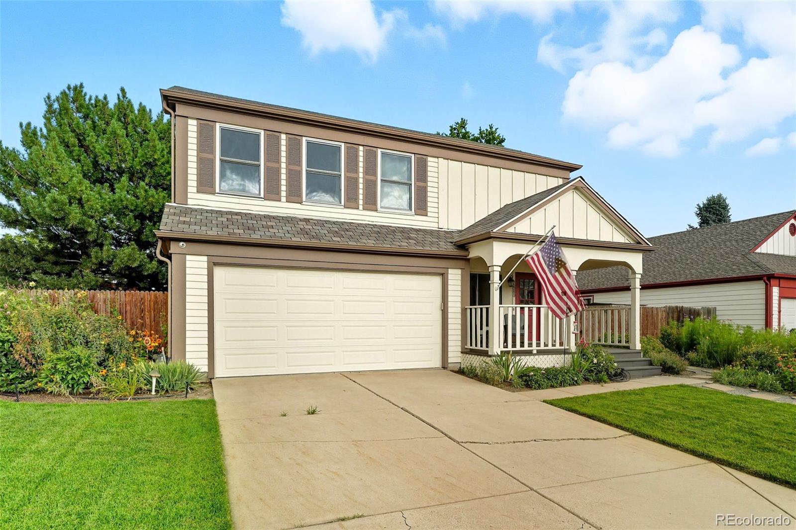 6080 Fenton Street Arvada, CO 80003 - Photo 9 of 48 a front view of a house with garden