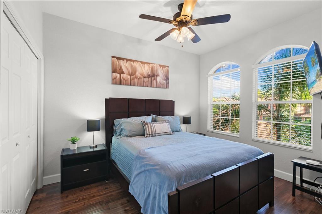 10021 Heather Lane, Unit 803 Naples, FL 34119 - Photo 17 of 41 a bedroom with a large bed and a window