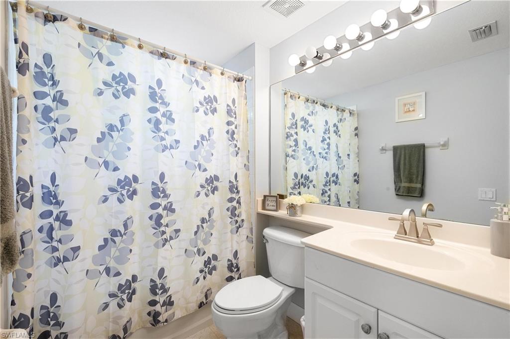 10021 Heather Lane, Unit 803 Naples, FL 34119 - Photo 20 of 41 a bathroom with a sink toilet and shower