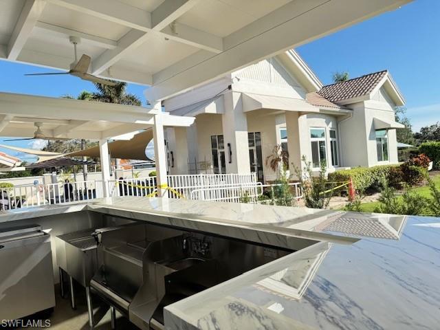 10021 Heather Lane, Unit 803 Naples, FL 34119 - Photo 36 of 41 a kitchen with a dining table and chairs