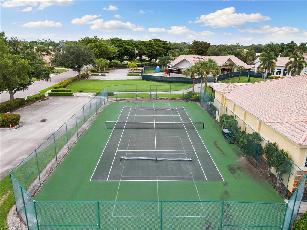 10021 Heather Lane, Unit 803 Naples, FL 34119 - Photo 37 of 41 a view of yard with swimming pool and green space