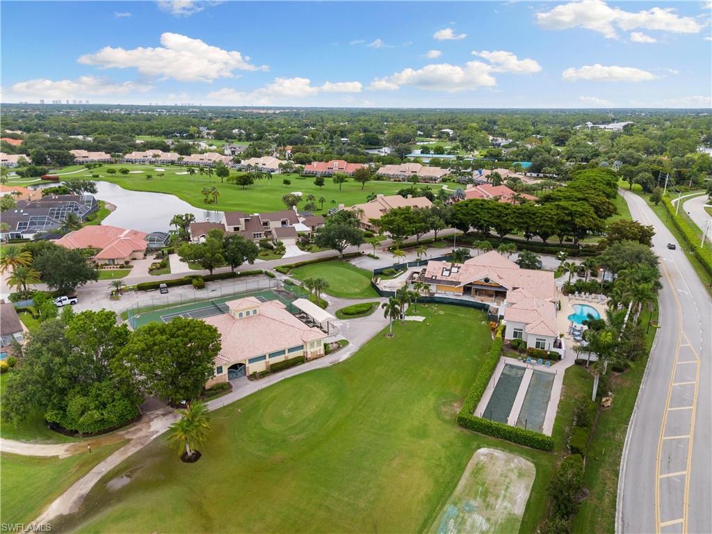 10021 Heather Lane, Unit 803 Naples, FL 34119 - Photo 38 of 41 an aerial view of a house with a lake view
