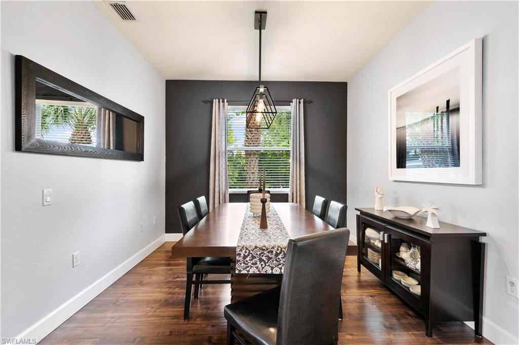 10021 Heather Lane, Unit 803 Naples, FL 34119 - Photo 7 of 41 a view of a dining room with furniture window and wooden floor