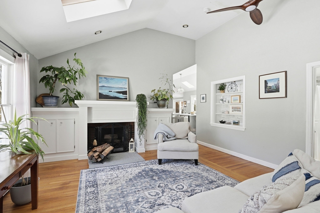 327 Country Way Scituate, MA 02066 - Photo 17 of 39 a living room with furniture and a fireplace