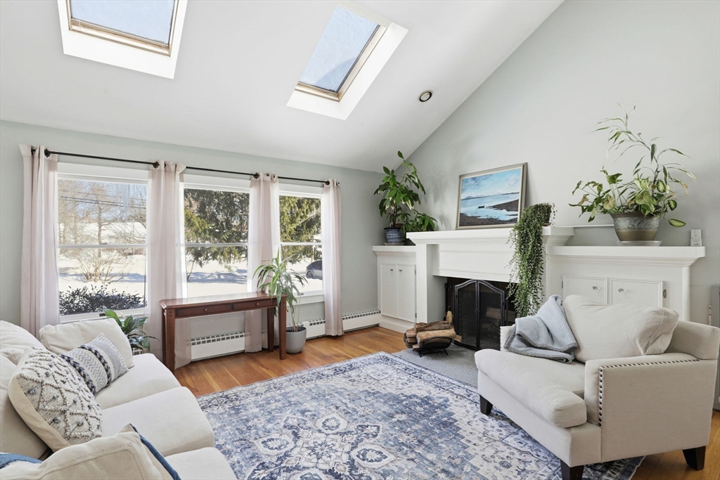 327 Country Way Scituate, MA 02066 - Photo 19 of 39 a living room with furniture and a fireplace