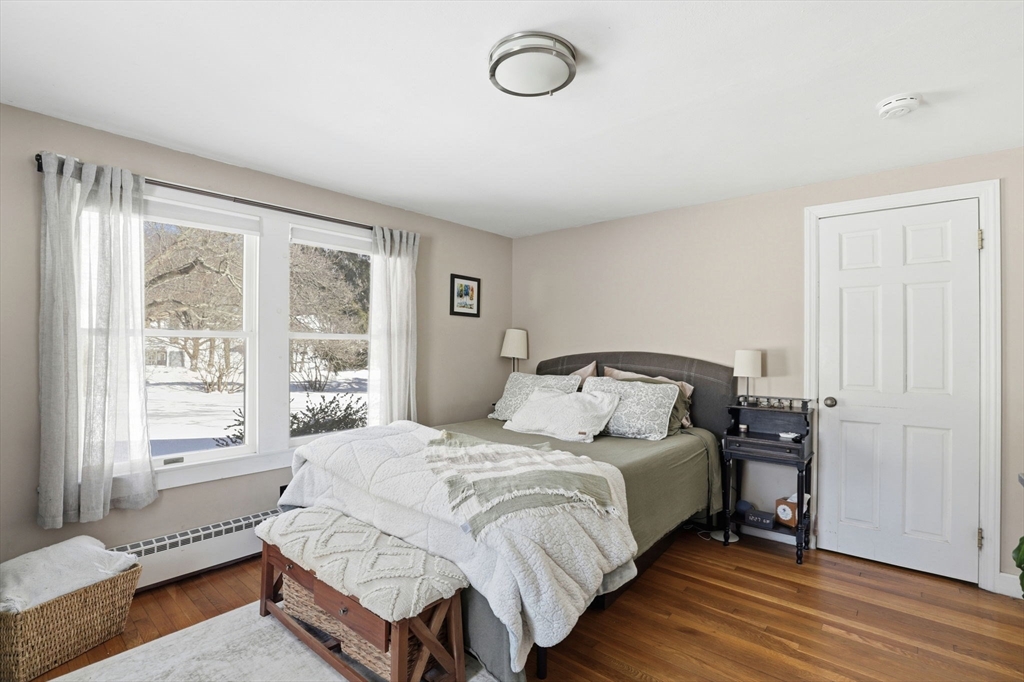 327 Country Way Scituate, MA 02066 - Photo 22 of 39 a large bed sitting in a bedroom next to a window