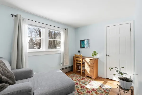 a bedroom with furniture and a window