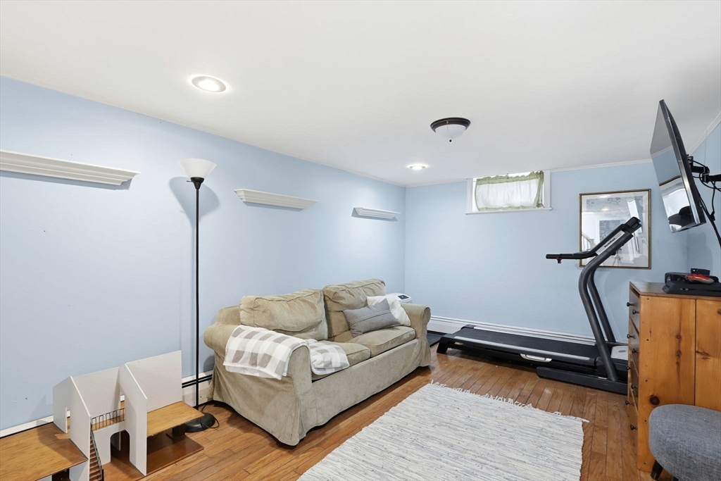 327 Country Way Scituate, MA 02066 - Photo 27 of 39 a living room with furniture and a wooden floor