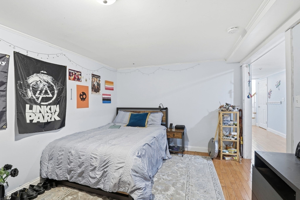 327 Country Way Scituate, MA 02066 - Photo 28 of 39 a bedroom with a bed and a walk in closet